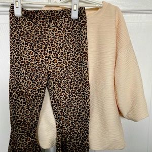 Like new condition bubble top in cream with leopard print flare stretch pants.